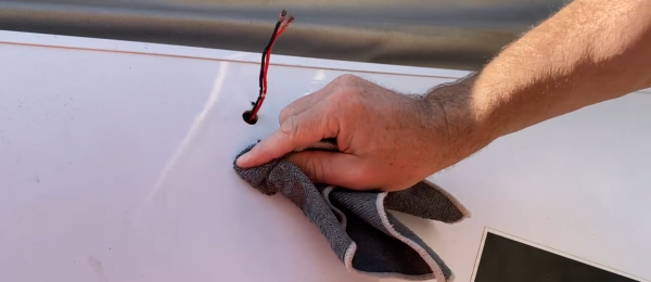 Using Cloth to Prepare Surface for Jayco Camper LED Awning Light