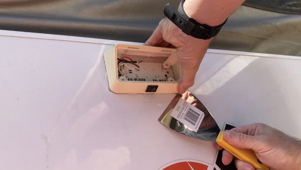 Using Sharp Paint Scraper to Cut Silicon From Jayco Camper LED Awning Light
