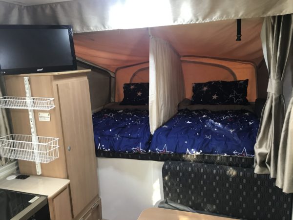 DIY Bed Divider for Jayco Swan Camper Trailer - FInished with Bedding in Place