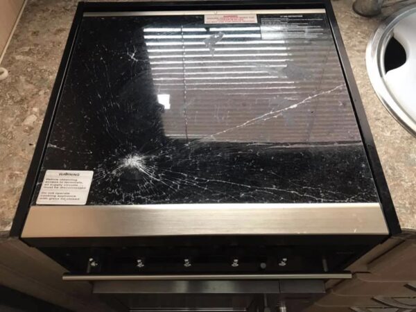 Smashed Jayco camper trailer stove top glass