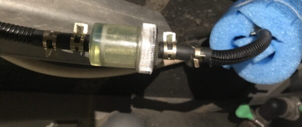 Suspend the fuel line away from hard surfaces to quieten diesel heater fuel pump