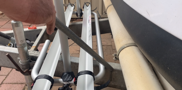 Inserting bed support poles with Bike rack on A frame of Jayco Swan Camper Trailer